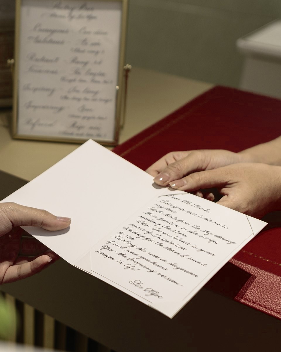 A guest receiving a poem card